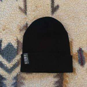 Dutch bros black beanie with a tag on the rim